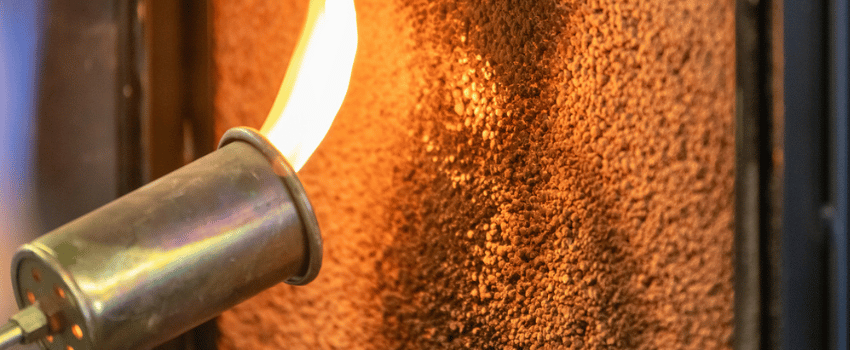 lose up of a flame torch testing flame retardant material, demonstrating fire resistance and safety in industrial applications